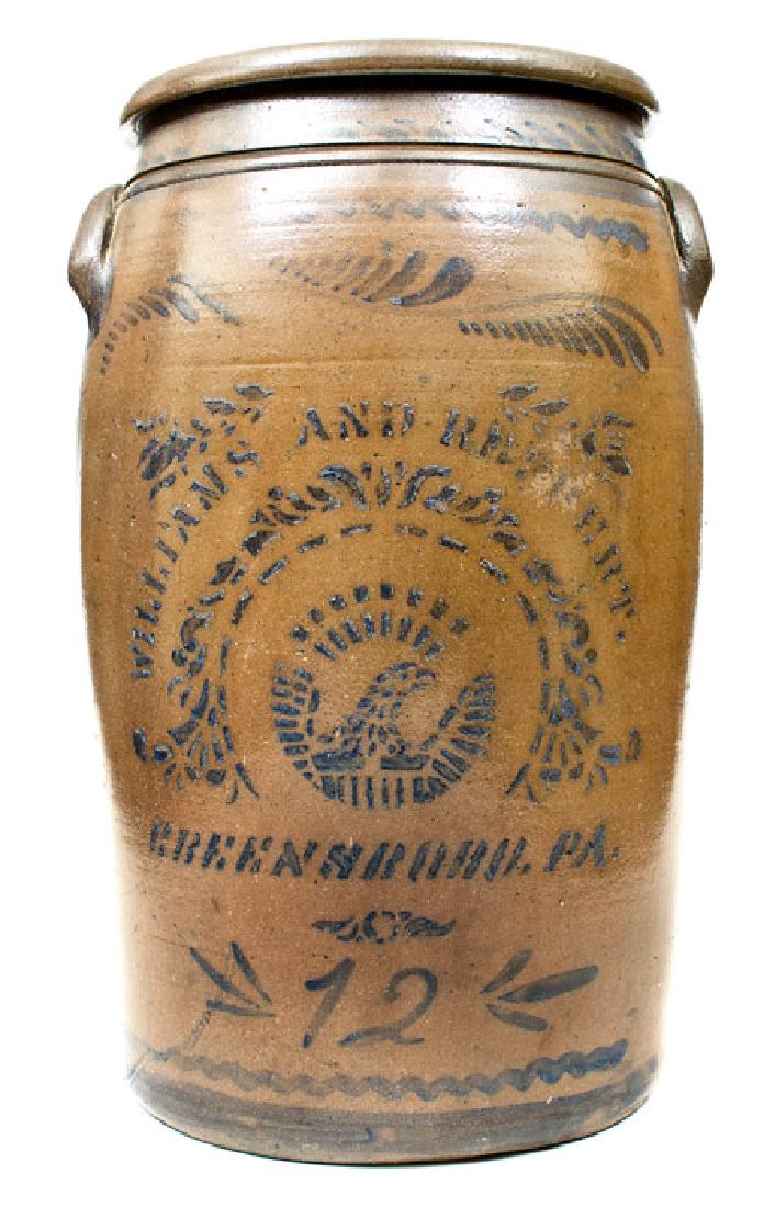 12 Gal. WILLIAMS & REPPERT / GREENSBORO, PA Stoneware: Twelve-Gallon Cobalt-Decorated Stoneware Jar with Stenciled Federal Eagle Decoration, Stenciled "WILLIAMS & REPPERT / GREENSBORO, PA", circa 1885, large-sized, cylindrical jar with tooled shoulder, ap