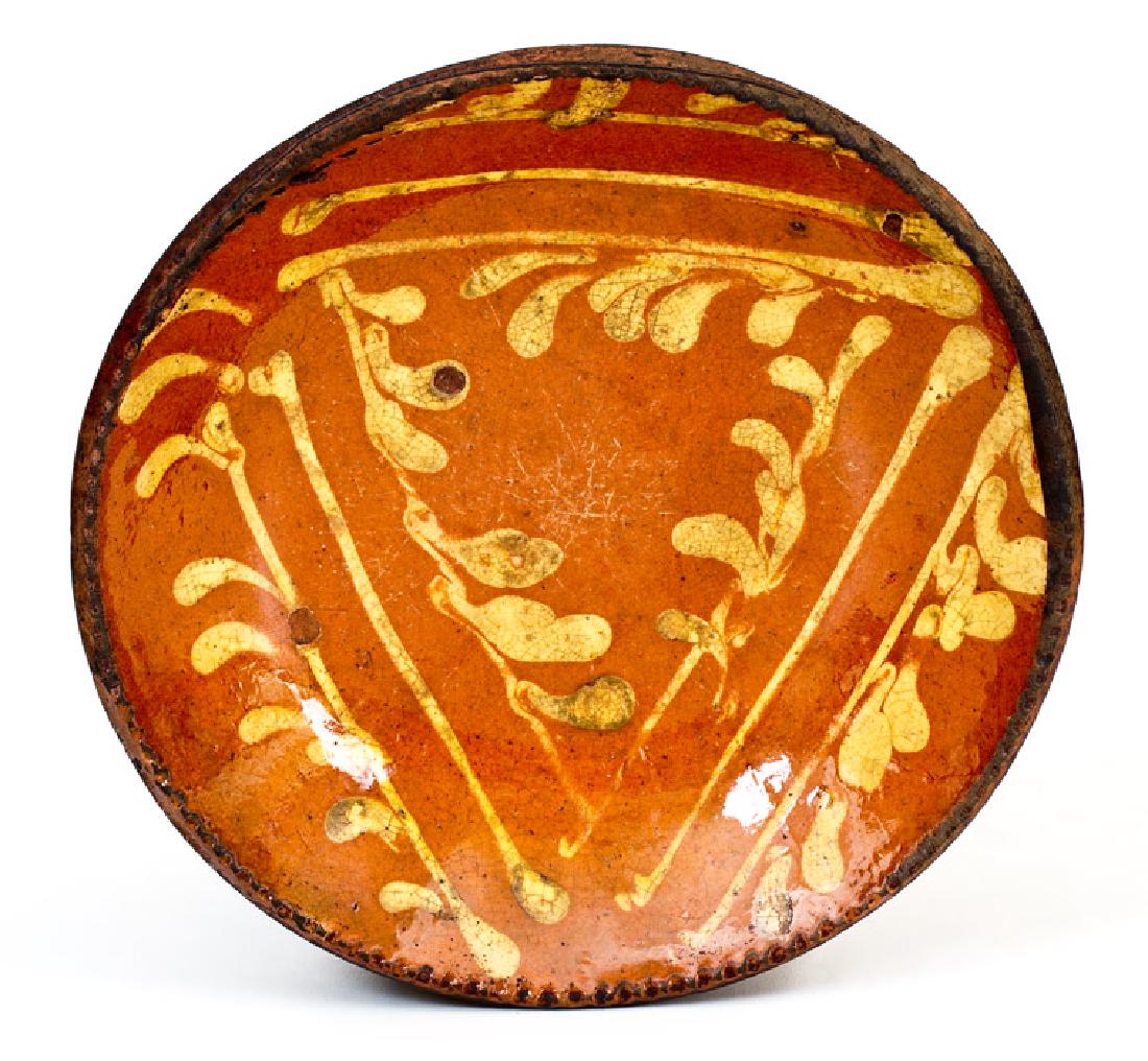 Small-Sized Redware Plate with Profuse Yellow Slip: Rare Small-Sized Redware Plate with Profuse Yellow-Slip Decoration, PA origin, early to mid 19th century, with coggled edge, the interior decorated with a striking triangular design of stripes and swa