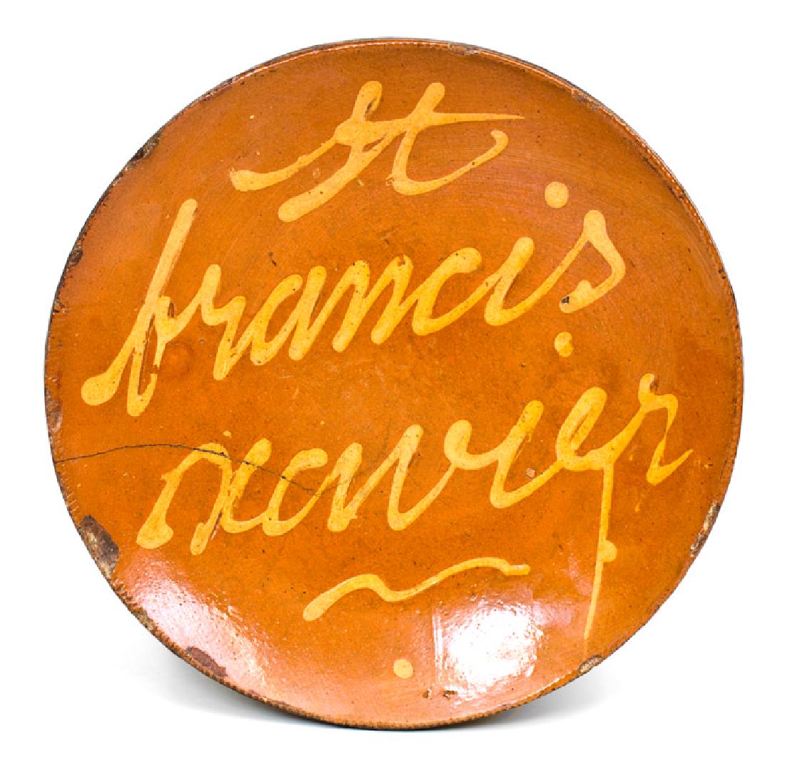 Rare Norwalk, CT Redware Plate Inscribed "St. Francis: Slip-Decorated Redware Plate, Inscribed "St francis xavier", Norwalk, CT origin, circa 1845, with coggled edge, the interior decorated with the large yellow-slip inscription, "St francis xavier", unde