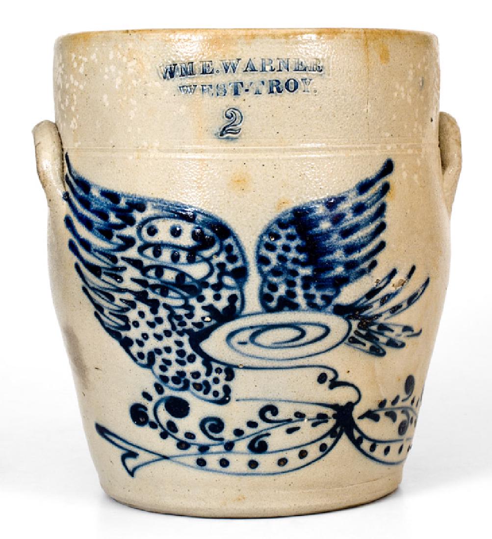 WM. E. WARNER / WEST TROY Eagle Crock: Two-Gallon Stoneware Jar with Cobalt Eagle Decoration, Stamped "WM E. WARNER / WEST-TROY.", NY State origin, circa 1855, ovoid jar with tooled shoulder and applied lug handles, decorated with a large 