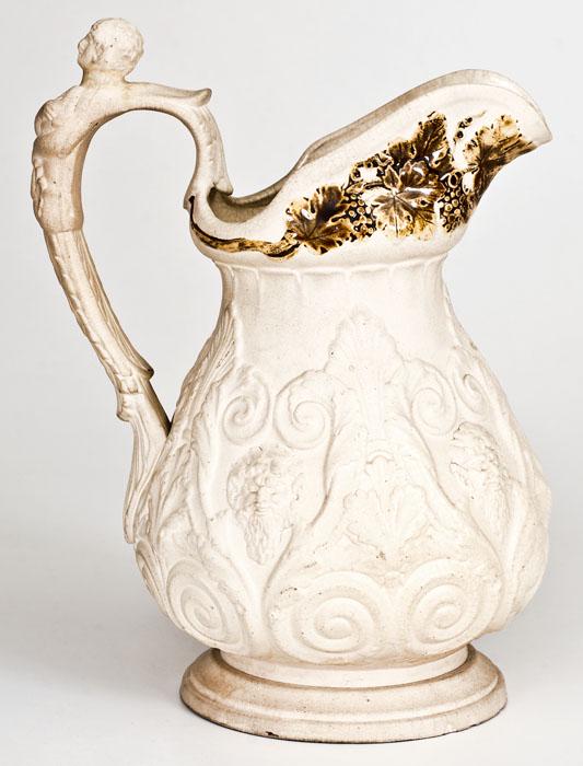 Extremely Rare Henderson / Jersey City, NJ Stoneware: Extremely Rare Slip-Decorated Stoneware Pitcher, Stamped "Henderson," David and James Henderson, Jersey City, NJ, circa 1829-1833, finely-molded pitcher with pedestal base, relief bearded satyr's head