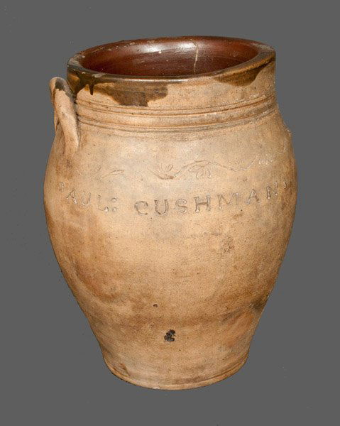 PAUL CUSHMAN (Albany, New York) Stoneware Crock with Co: Early Stoneware Jar with Coggled Decoration, Marked "PAUL: CUSHMANS," Paul Cushman, Albany, NY, circa 1810, approximately two-gallon ovoid jar with heavily tooled shoulder, decorated with a coggled vi