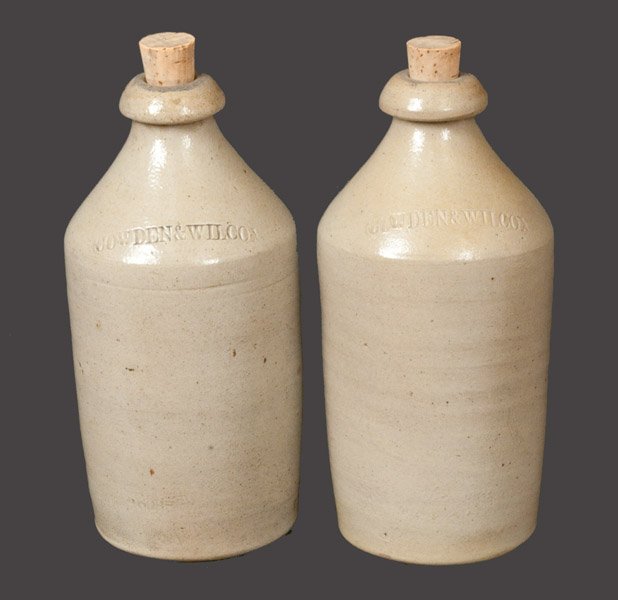Lot of Two: COWDEN & WILCOX Stoneware Bottles: Two Salt-Glazed Stoneware Bottles, Stamped "COWDEN & WILCOX," Harrisburg, PA origin, circa 1865, both of cylindrical form with tapered necks and blob tops, including "COWDEN & WILCOX" on shoulder. Bot