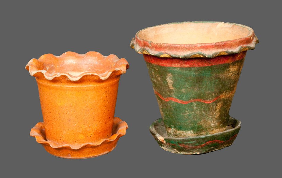 Two Pennsylvania Redware Flowerpots: Two Redware Flowerpots, Pennsylvania origin, 19th century. a small lead-glazed flowerpot with crimped rim and original separate saucer, paired with a painted redware flowerpot with crimped rim and att