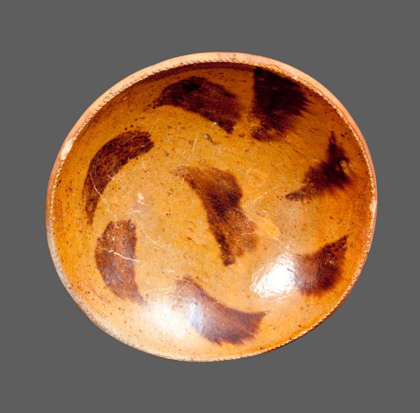 Redware Dish with Manganese Decoration, Excavated in Be: Glazed Redware Dish, Pennsylvania origin, second half 19th century, with coggled edge, the interior decorated with a swirled pattern of manganese daubs. Provenance: Excavated in Bethlehem, PA. Some kn