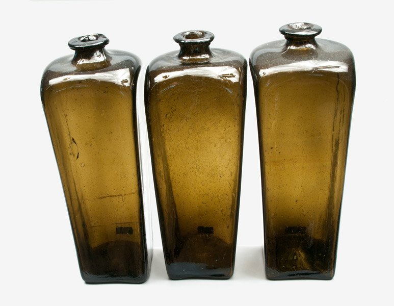 Three Olive Case Gin Bottles, Dutch, 18th century: Three Olive Case Gin Bottles, Dutch, 18th century, including one with crude spout and one with numerous bubbles throughout. Provenance: Bill Cheesman Collection, Glen Burnie, MD. One with short crack 