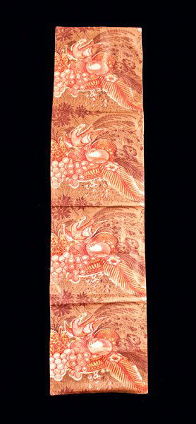 Rare Chintz Table Runner, c1800: Rare Early Polished Chintz Table Runner, American, circa 1800, featuring a repeating red design of a bird of paradise perched atop a fruite compote with brown floral background. Tan backing on reverse