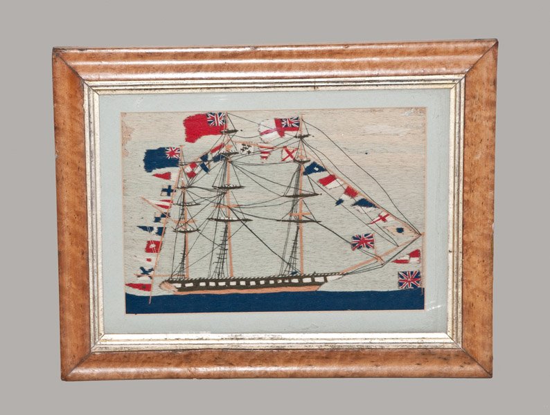 Woolwork of a Sailing Ship, English, 19th century: Woolwork of a Sailing Ship, English, 19th century, depicting a sailing ship on water, bedecked with various flags including the Union Jack. Included in a 19th maple veneer frame with gilt border. Wool