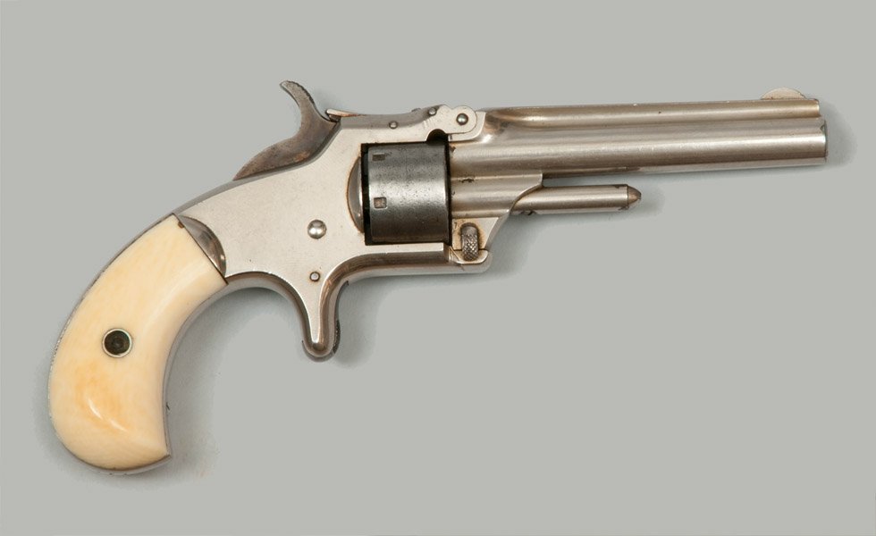 Smith & Wesson .22 1st Model, Third Issue Revolver: Smith & Wesson First Model, Third Issue Revolver with round .22 caliber 3.25" barrel and beautiful ivory grips. Light rust, wear to end of rod, light pitting to cylinder.