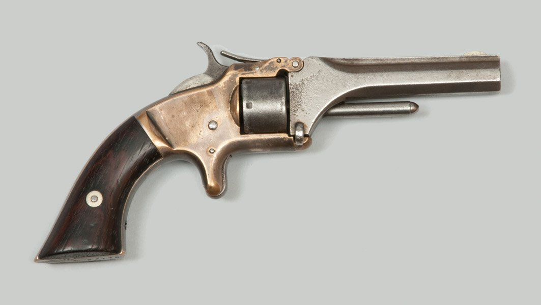 Smith & Wesson .22 Cal 2nd Model, First Issue Revolver: Smith & Wesson Second Model, First Issue Revolver, .22 caliber 3.25" octagonal barrel. Blued barrel, brass frame, rosewood grips, engraving "Frank" above serial number 83770. Corrosion of finish to ba