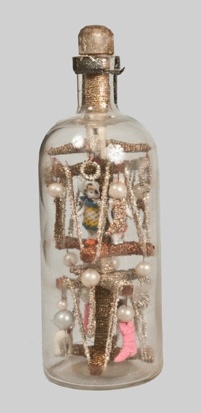 Christmas Tree in a Bottle Whimsey, late 19th century: Christmas Tree in a Bottle Whimsey, late 19th century, the glitter-decorated tree decorated with rows of faux tinsel, stockings, miniature dolls with moveable arms, white balls, and other designs. Han