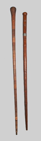 Two Wooden Canes, including Tiger Maple Dagger Cane, 19: Two Canes, Including Fine Dagger Cane, 19th and/or 20th centuries, a tiger maple dagger cane with rounded grip, turned accents, and metal band near handle, 19th century; paired with a segmented wooden