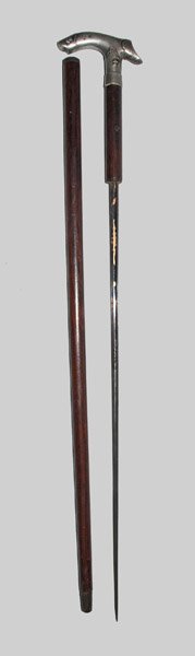 Fine Dagger Cane, probably French, late 19th century: Fine Dagger Cane, European origin, possibly French, late 19th century, with wooden shaft (possibly rosewood) and metal handle featuring fleur-de-lis motifs, the blade with gilded and blued foliate des