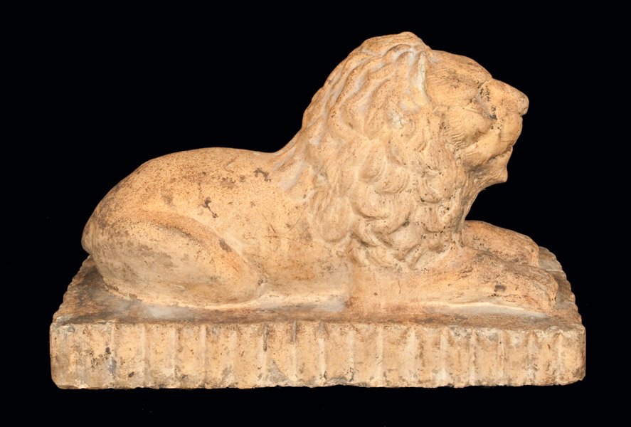 Stoneware Lion Doorstop, Ohio origin: Stoneware Lion Doorstop, Ohio origin, fourth quarter 19th century, unglazed stoneware doorstop molded in the form a reclining lion on a rectangular, scallop-edged base. Chips to ears and some small, s
