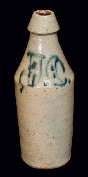 Stoneware Bottle with Ornate Slip-Trailed J.C. And: Stoneware Bottle with Cobalt Initials "J.C.," Northeastern U.S. origin, third quarter 19th century, cylindrical bottle with tapered spout, featuring the large slip-trailed cobalt initials, "J.C.," acc