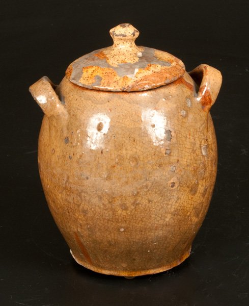 Lidded Redware Jar with Yellow-Slip Coating and Strap: Lidded Redware Jar with Slip Decoration, American, early 19th century, ovoid jar with open strap handles and original domed lid, the surface covered in a heavy yellow slip and covered in a clear lead