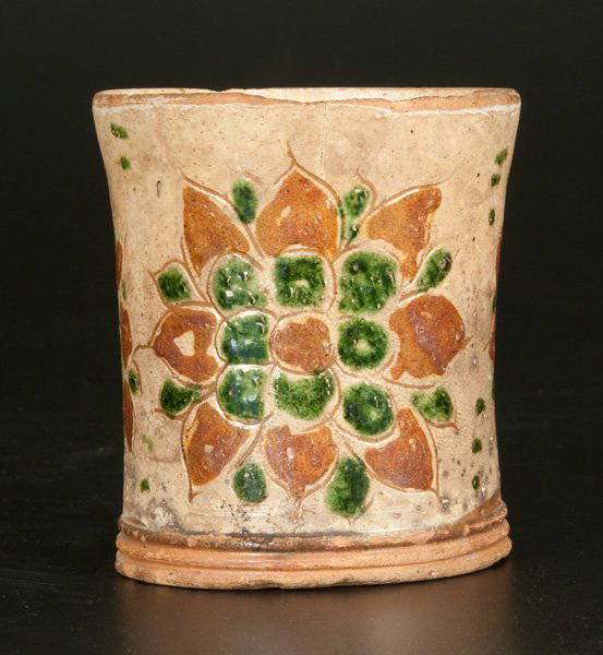 Very Rare Sgraffito Mug, Southeastern PA, Late 18th: Very Rare Sgraffito-Decorated Redware Mug, Southeastern PA origin, circa 1825, cylindrical mug with stepped, footed base and ribbed strap handle, decorated with three large and well-detailed flower bl