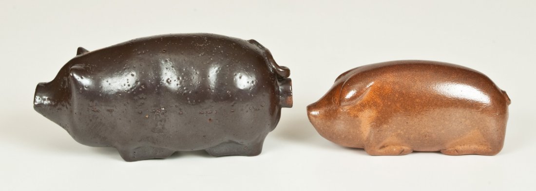 Lot of Two: Stoneware Pig Bottles, incl. DICKEY CLAY: Two Sewertile Pig Bottles, Midwestern origin, late 19th or early 20th century, both molded in the form a reclining pig with hole at rear and anatomically-correct underside, including a scarce, small-s