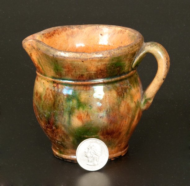 Very Rare Miniature Shenandoah Valley Redware Cream: Very Rare Miniature Shenandoah Valley Redware Cream Pitcher, attributed to S. Bell & Sons or J. Eberly & Co., Strasburg, VA, late 19th century, squat-shaped, ovoid pitcher with flared collar and foote