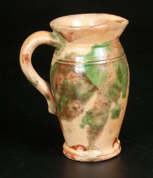 Shenandoah Valley Multi-Glazed Redware Cream Pitcher: Shenandoah Valley Multi-Glazed Redware Cream Pitcher, attributed to S. Bell & Sons or J. Eberly & Co., Strasburg, VA, late 19th century, ovoid pitcher with footed base, tooled shoulder, and flared rim