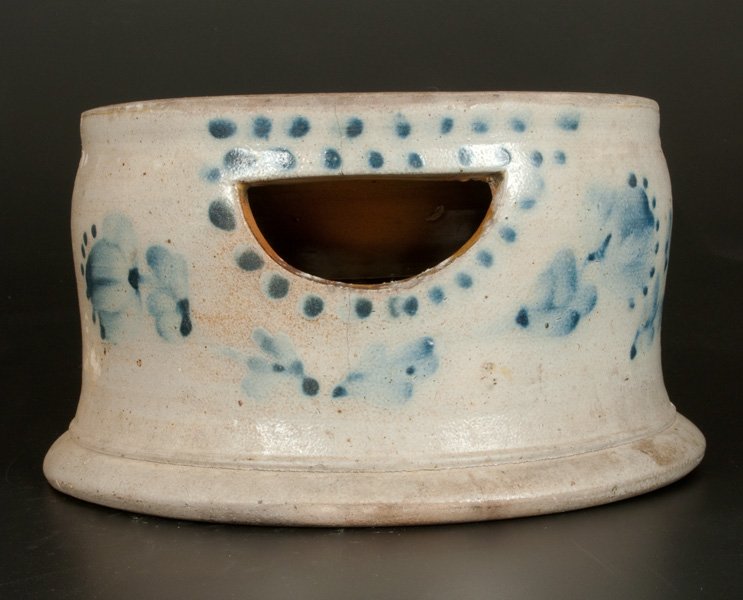 Stoneware Spittoon with Profuse Floral Decoration: Large-Sized Stoneware Spittoon with Elaborate Cobalt Floral Decoration, PA or NJ origin, third quarter 19th century, with footed base, carved semi-circular opening at shoulder, and Albany-slip-glazed 