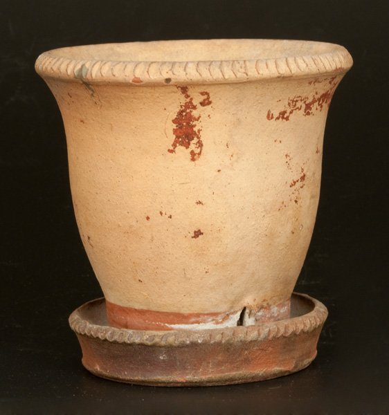 Redware Flowerpot with Attached Saucer: Shenandoah Valley Redware Flowerpot, attributed to S. Bell & Sons, Strasburg, VA, late 19th century, ovoid flowerpot with attached saucer, the rim and saucer with coggled treatment. Flowerpot dipped i