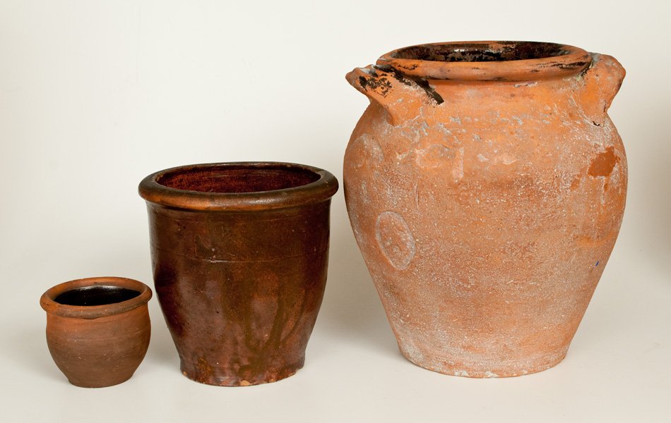 Lot of Three: Redware Jars with Tennessee Provenance: Three Great Road Redware Jars, Tennessee origin, 19th century, a scarce miniature ovoid jar with tooled shoulder, rounded rim, and speckled lead-and-manganese-glazed interior, found in Sullivan County