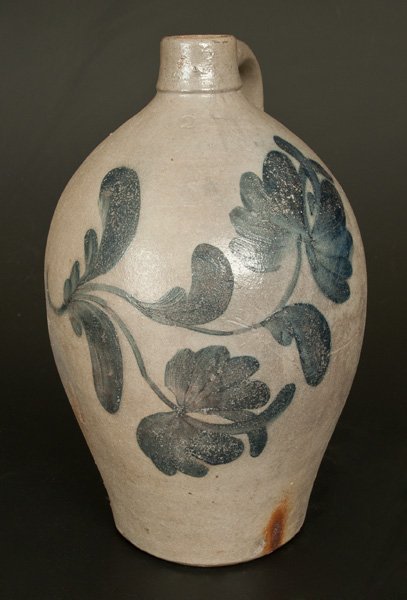 Ovoid Beaver, PA Stoneware Jug with Large Floral: Two-Gallon Stoneware Jug with Cobalt Floral Decoration, Beaver, PA origin, circa 1865, ovoid jug with tall spout, the surface covered in whitish slip and decorated with a boldly-brushed fuchsia vine d