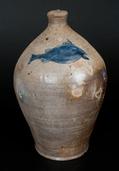 RareStoneware Incised Fish Jug, attrib. Paul Cushman,: Rare Early Two-Gallon Stoneware Jug with Incised Fish Decoration, attributed to Paul Cushman, Albany, NY, circa 1810, ovoid jug with tooled spout and ribbed handle, decorated with a whimsical incised