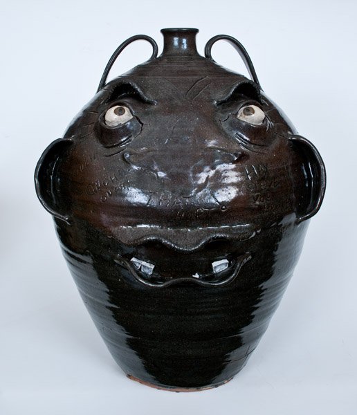 Exceptional 19" Steven Abee Stoneware Face Jug circa: Exceptional Large-Sized Stoneware Face Jug with Humorous Inscription, Signed "Steven Abee / Lenoir, NC," North Carolina origin, skillfully-potted, ovoid jug with two handles and tooled shoulder, the f
