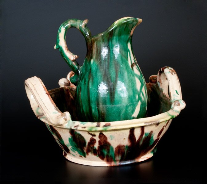 Shenandoah Valley Multi-Glazed Redware Pitcher and: Exceptional Shenandoah Valley Multi-Glazed Redware Pitcher and Washbowl Set, attributed to J. Eberly & Co., Strasburg, VA, circa 1890, vasiform pitcher with footed base, upswept spout, and applied spu