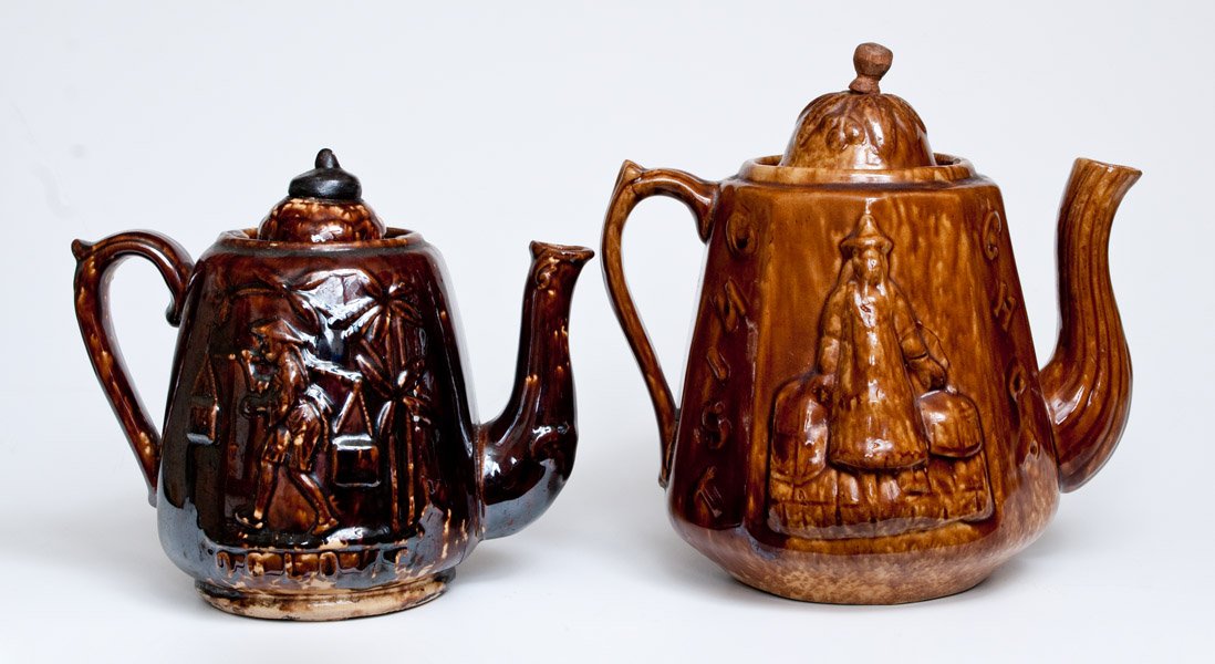 Lot of Two: Unusual Rockingham Ware OOLONG Teapots att.: Two Unusual Rockingham Teapots with Chinese Motifs, attributed to the Swan Hill Pottery, South Amboy, NJ, second half 19th century, one with Chinese man carrying tea bales, with embossed words "CHOP /