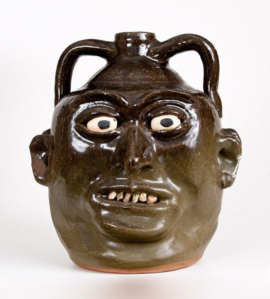 Lanier Meaders Double Face Jug: Alkaline-Glazed Southern Stoneware Double Face Jug, Signed "Lanier Meaders," Cleveland, GA, 20th century, ovoid jug with two applied handles, the body decorated on two sides with applied clay face inc