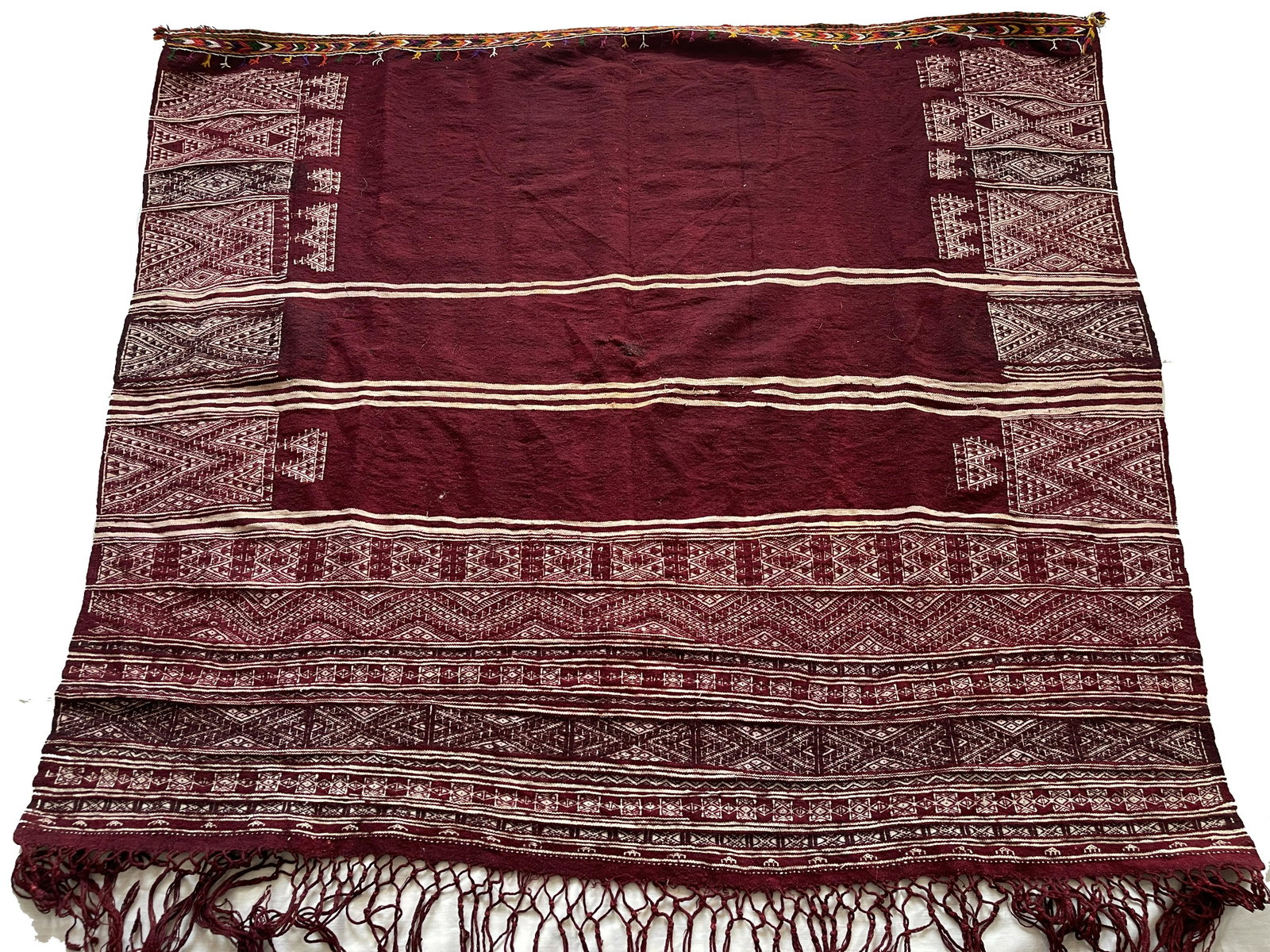 Old Tunisian Shawl - Berber People: Antique Tunisian weaving shawl Superbly woven Dyed in two rich shades on Maroon and Plum Dyeing is hand done so it is not even and in some places appears patchy. Size: 128 x