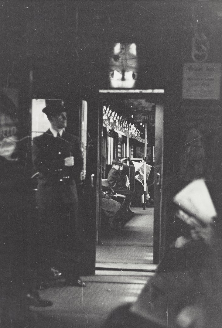 Attrib. to Lou Stoumen, Subway Car Interior, 1940.: Attributed to Lou Stoumen (1917-1991), A black and white snapshot view of the interior of a New York City subway car showing conductor and passengers. Written in pencil on verso in unknown hand, "Phot