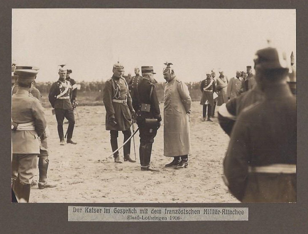 Kaiser Wilhelm II with French Officer, 1908.: Black and white photograph of Kaiser Wilhelm II in Uhlan uniform, German officers, and the French Military Attache. Inscription below photograph in German, "Der Kaiser im Gesprach mit dem franzosische