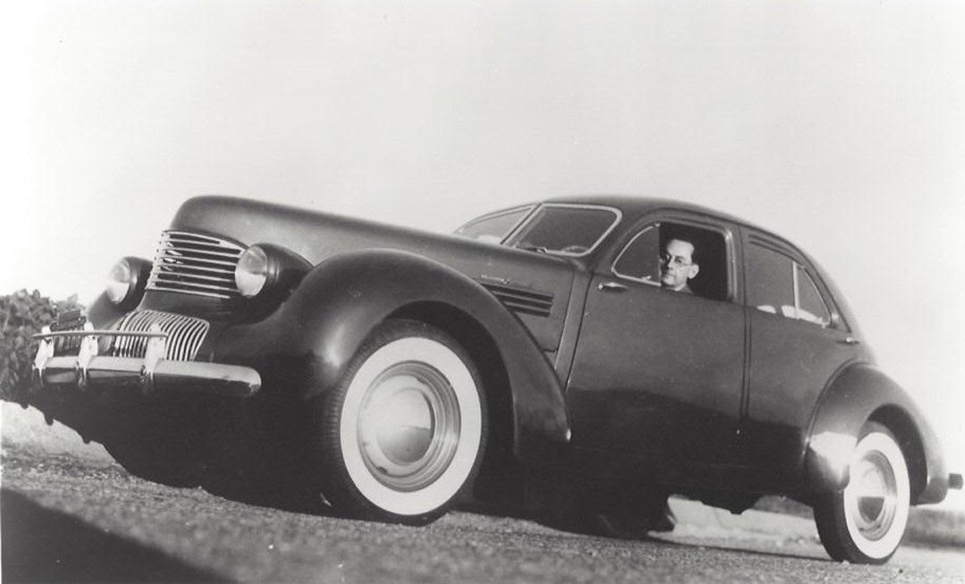 Man Ray in His Graham "Hollywood Supercharger": Man Ray in his Graham 'Hollywood Supercharger,' 1948 by Man Ray. Photographic print. Gallery press print. Unsigned. Exhibition label: Track 16 Gallery Smart Art Press Photographer: Man Ray. Medium: Ph