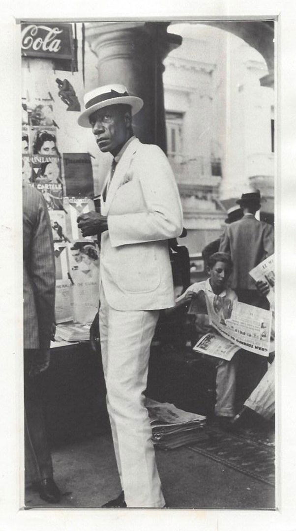 Citizen in Downtown Havana (1932): WALKER EVANS. Black and white photograph, August 14, 1977. Silver print. Press print. Unsigned. Photographer: Walker Evans. Medium: Silver print. Measurements: 9 5/8 x 6 1/4