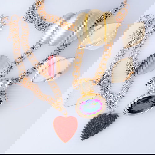 Six pieces of 14k and 18k gold jewelry: Six pieces of 14k and 18k gold jewelry: 18k yg ring, size 6; 18k yg and wg earrings for unpierced ears, marked Jondell; 14k yg and mystic topaz enhancer on chain; 14k yg charm bracelet with three old