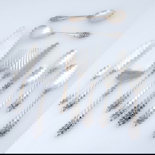 Wallace Silversmiths sterling flatware service in: Wallace Silversmiths sterling flatware service in the Grand Baroque pattern. One hundred seven pieces: seventeen teaspoons, 6"; twelve bouillon spoons, 6"; nineteen soup spoons, 7"; nineteen cake fork