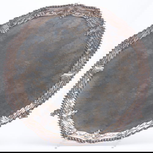 George II silver salver by John Carter II, London: George II silver salver by John Carter II, London 1768. Raised and readed rim with garland ornament on three ball and claw feet, centers a lion rampant. 32 ozs.; 13" dia, ht. 1 1/2"