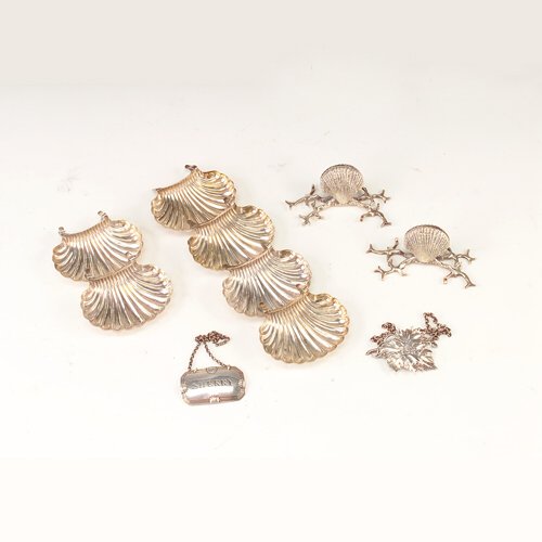 Sheffield plate table accessories, ten pieces incl: Sheffield plate table accessories, ten pieces incl. two place card holders, shell-shaped salts, and two bottle labels