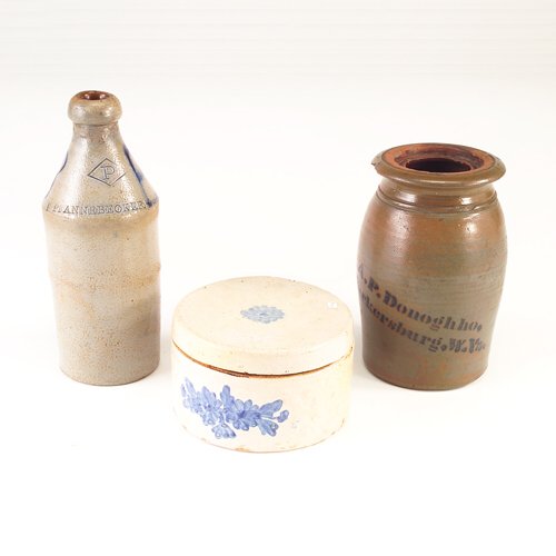 Three Stoneware pieces: bottle with cobalt "B" inc: Three Stoneware pieces: bottle with cobalt "B" incised P/Pfannebecker in diamond monogramm (repair to neck), 10"; redware salt glazed jar without lid "A P Donoghho, Parkersburg, W. Va," 8", and Europe