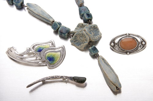 Arts & Crafts period jewelry in sterling: brooch of