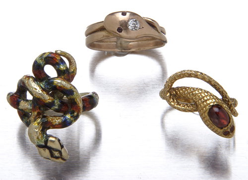 Three gold serpent rings: coiled serpent in 14K wit