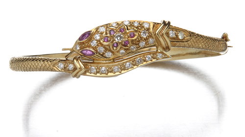 Hinged serpent bangle with rubies and diamonds18k