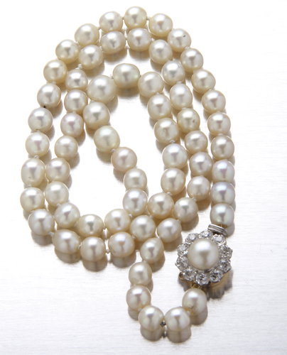 Natural pearl necklace with diamond clasp: sixty-fi