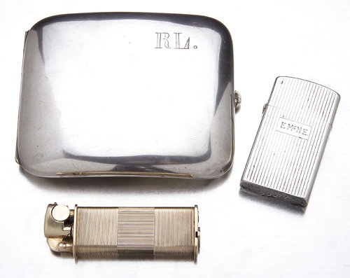 A sterling Zippo cigarette lighter; a 14K yellow g