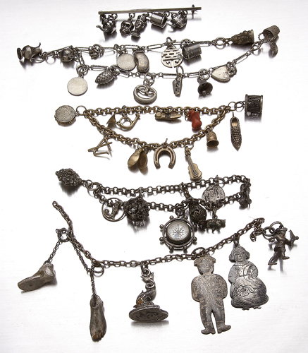 Fifty-one 19th and early 20th c. charms, some gold