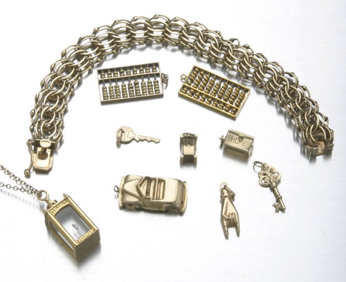 14K yellow gold charm bracelet with assorted 14K a